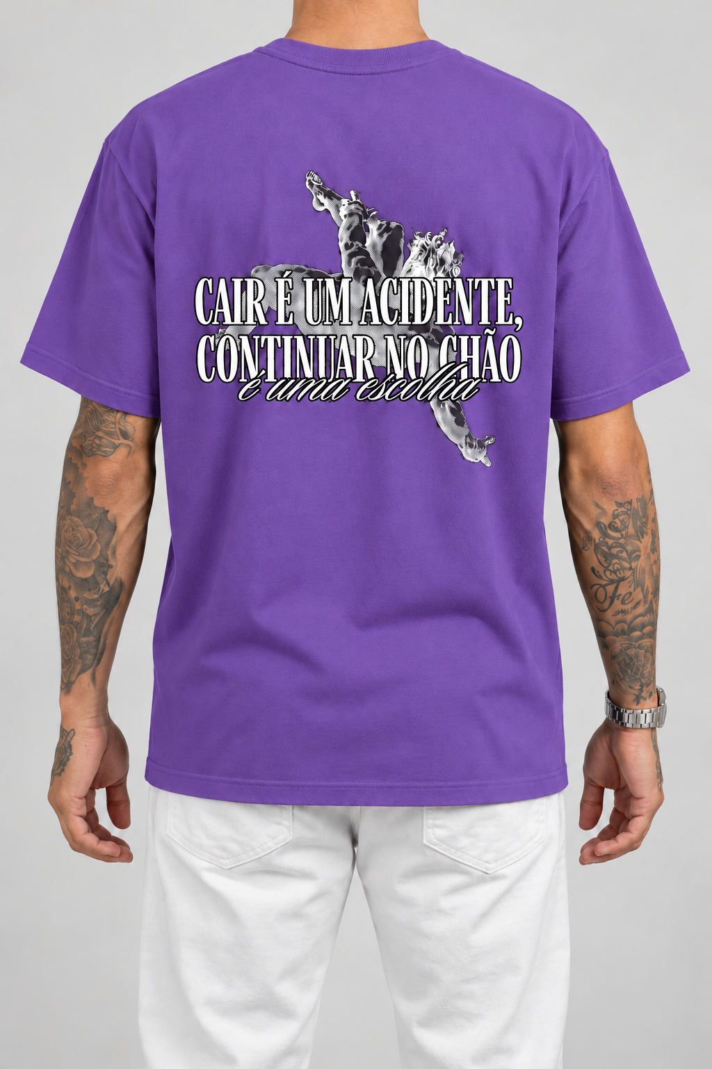 Cor: Roxo | Costas | Camiseta Cair é um Acidente, Continuar no Chão é uma Escolha (Verso)