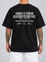 Cor: Preto | Costas | Oversized — Camiseta Sonhos se Tornam Realidade, Quando Você não Dorme (Verso)